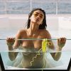 Big nude boobs of Kelly Gale in transparent bathtub