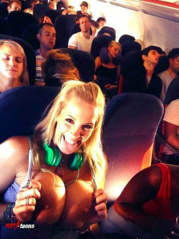 Crazy teen flashing huge tits in a full jet