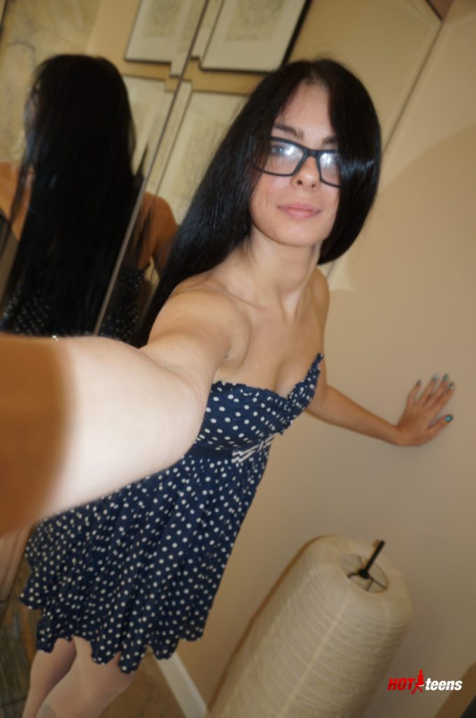 Sexy babe with glasses in dress