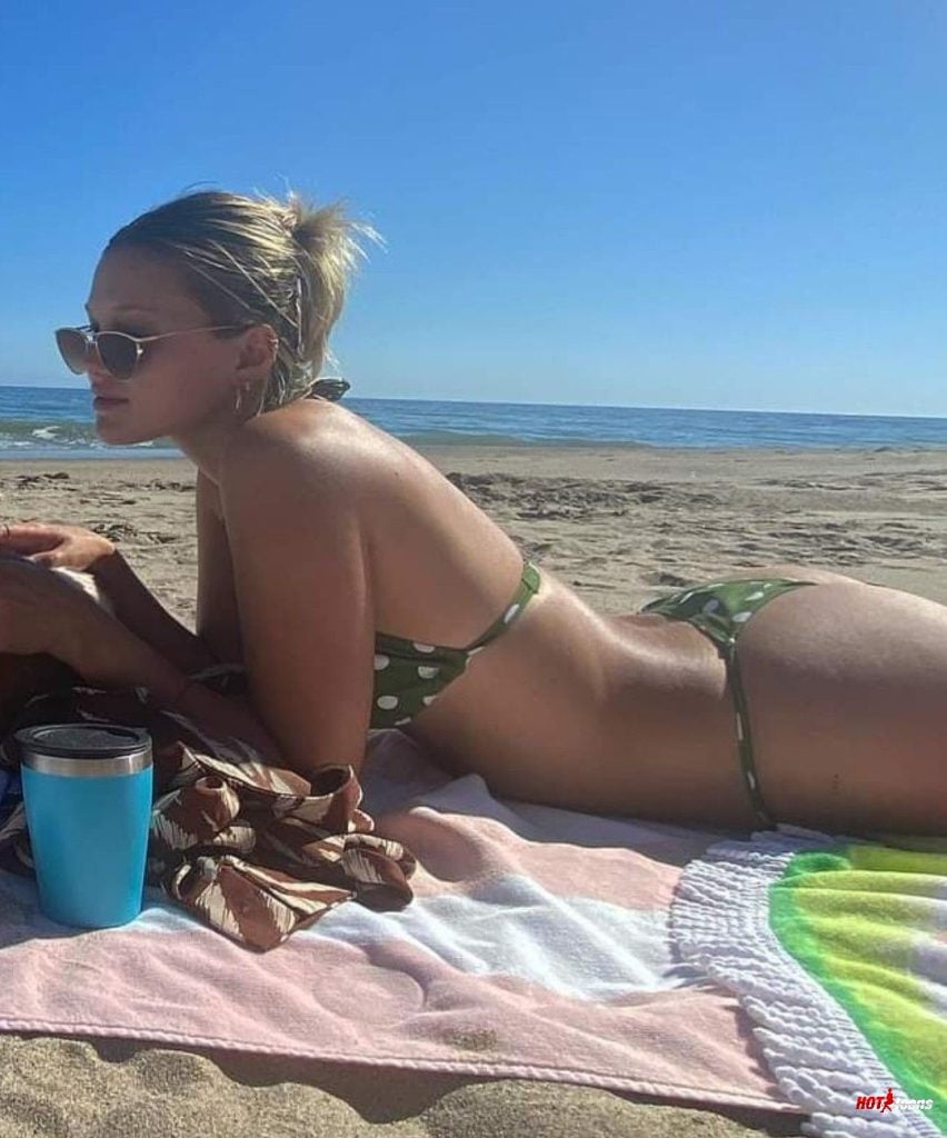 Olivia Holt sunbathing in tiny bikini