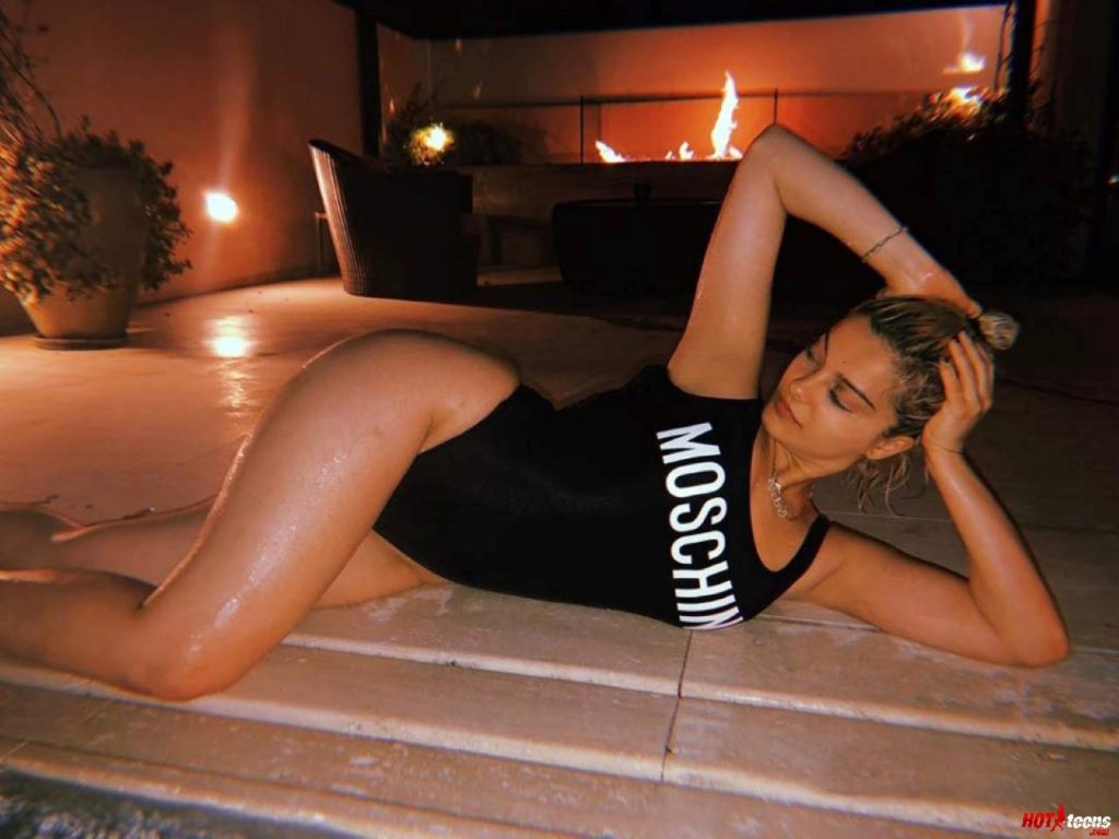 Sexy celeb in Moschino swimsuit