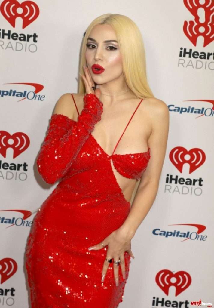 Ava Max boobs popping out of dress