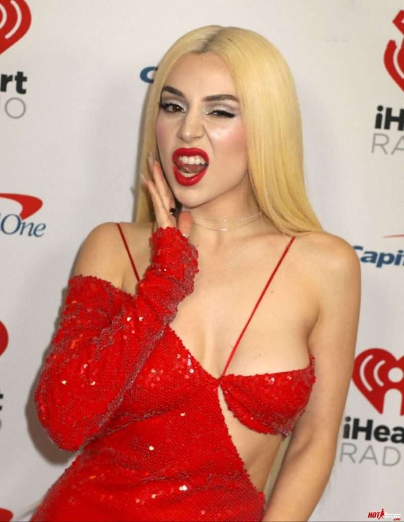 Ava Max almost nude in tiny red dress