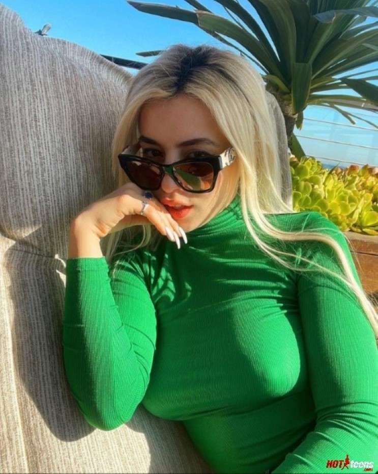 Ava Max in green shirt