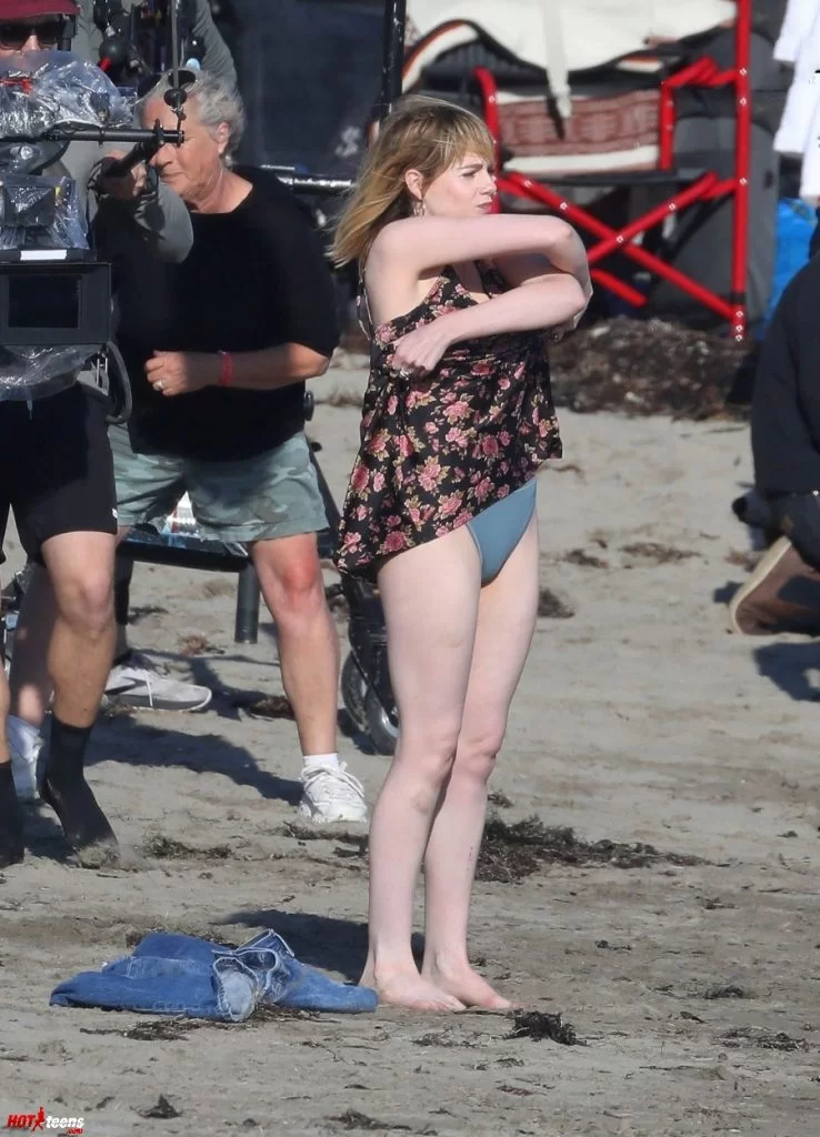 Lucy Boynton undressing at the beach