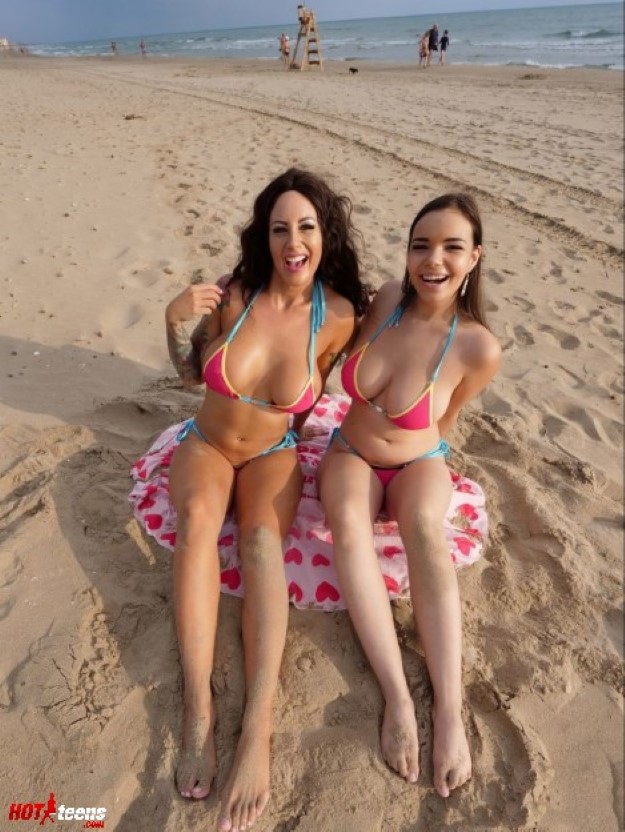 Busty bikini besties in public beach
